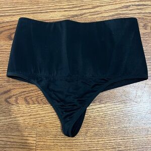 Nip, Tuck & Boost. Black High-Waisted tummy control shaping thong